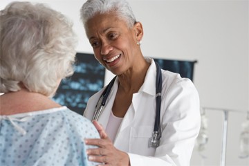 Photo of doctor speaking to patient